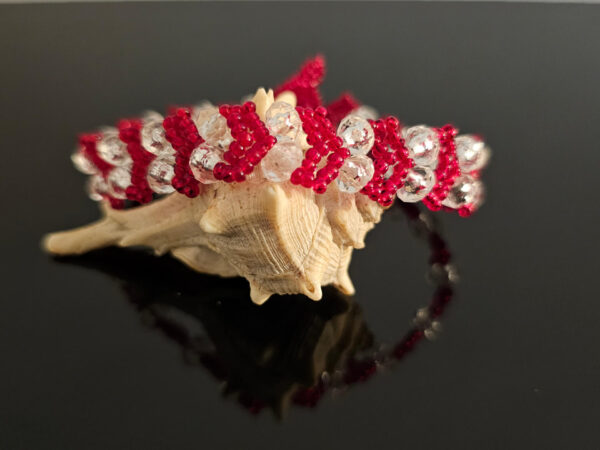 Red Heart bracelet on a shell