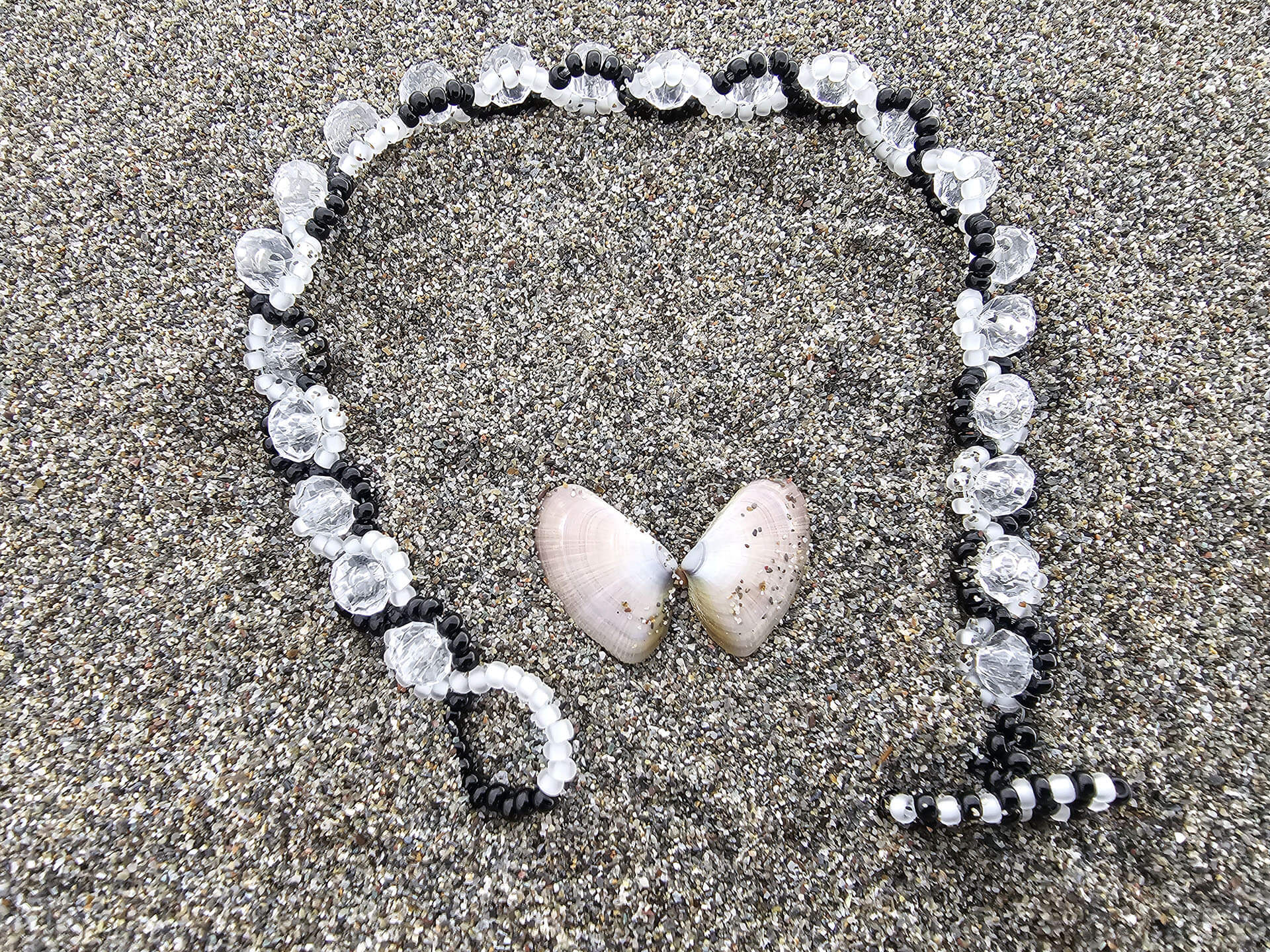 “Yin and Yang” Bracelet in a circle on the beach