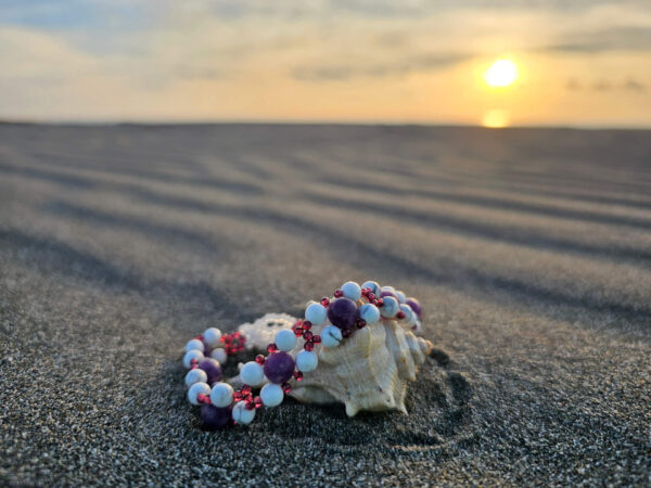 Healing Peace Gemstone bracelet at the beach on a shell