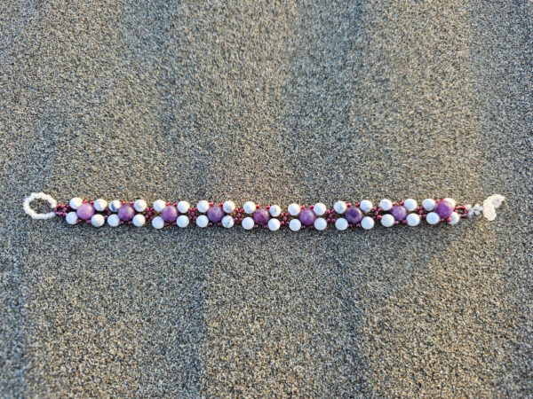 Healing Peace bracelet full length on a sand