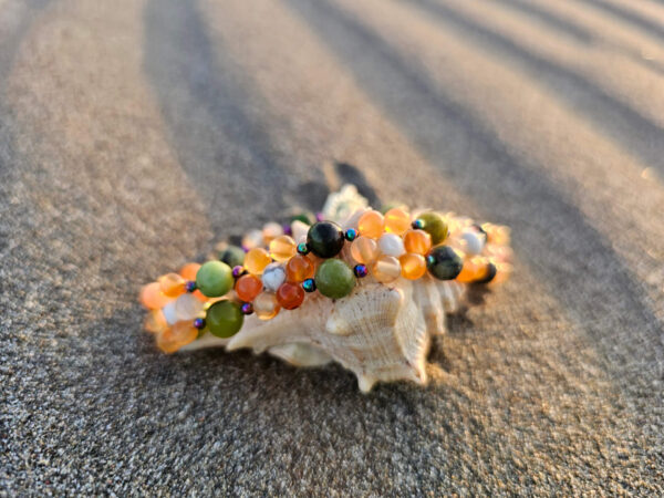 Flower of Life on the beach on a shell